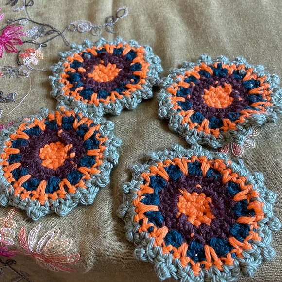 Hand crocheted Mandala coasters in sage green, orange, dark teal and brown. - Picture 3 of 6